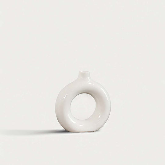 Elegant ceramic donut vase with smooth white finish hollow center design decorative modern vase for home interior styling.