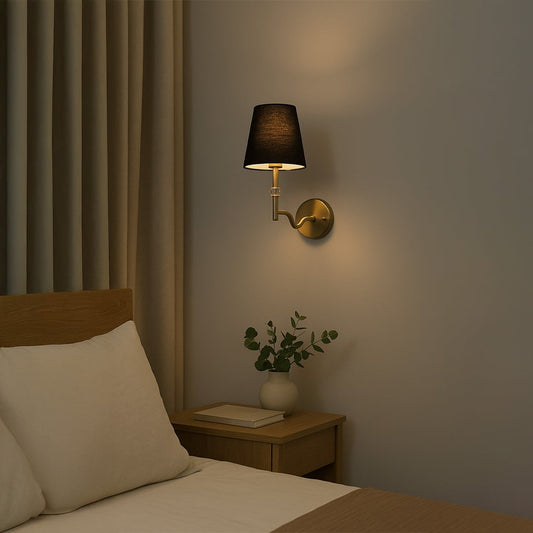 Gold metal wall light with black fabric shade and crystal detail styled in a modern room adding warm ambient lighting for bedrooms hallways and living areas.