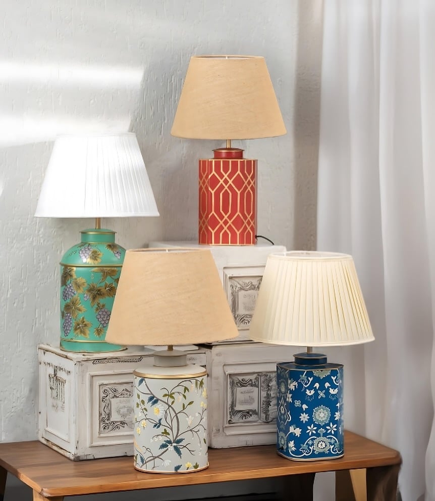 A group of Palais ceramic table lamps in mint green red cream and blue tones each with elegant hand painted patterns and shades.