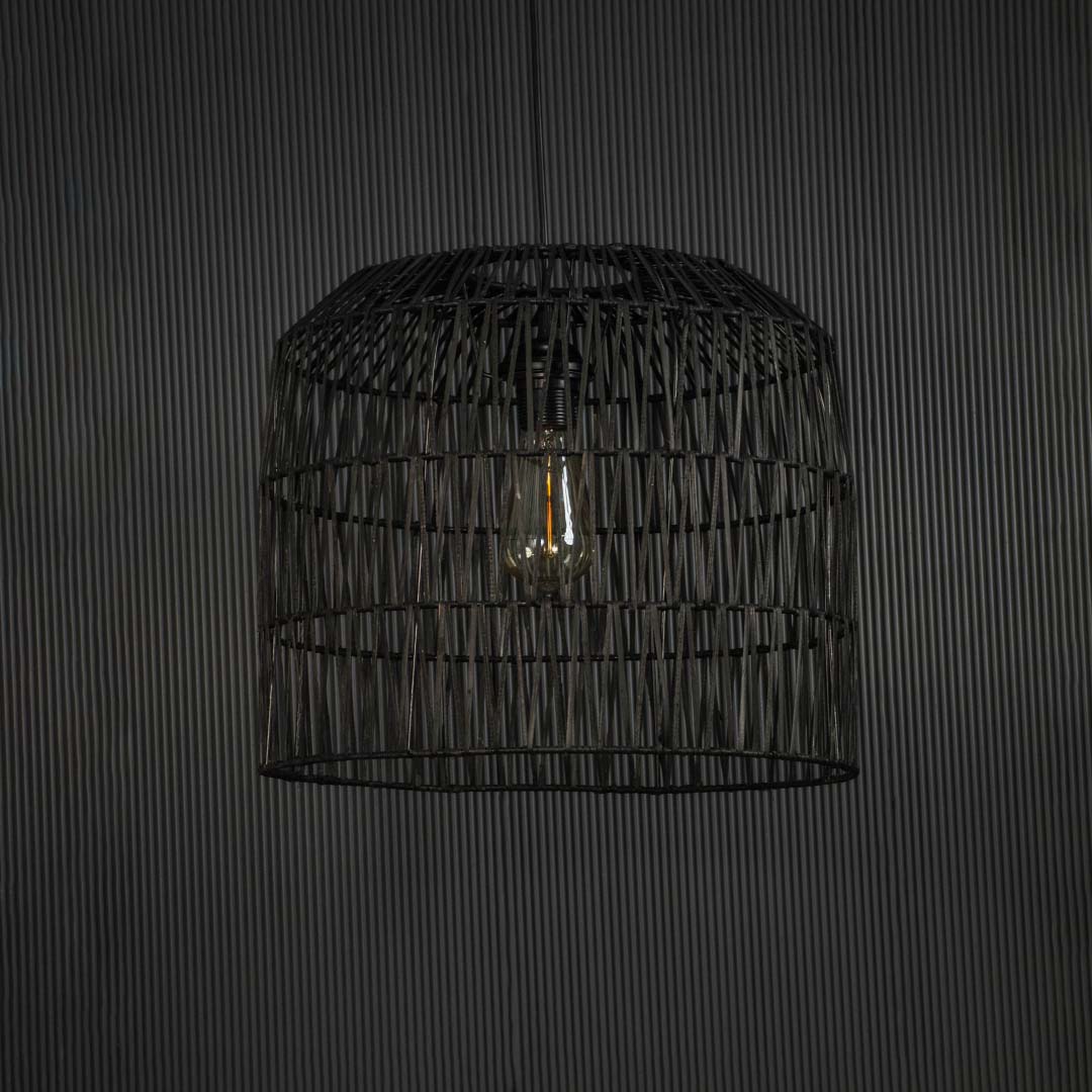 Elegant black woven wire pendant light against dark background featuring minimalist handwoven design and sleek artistic texture.