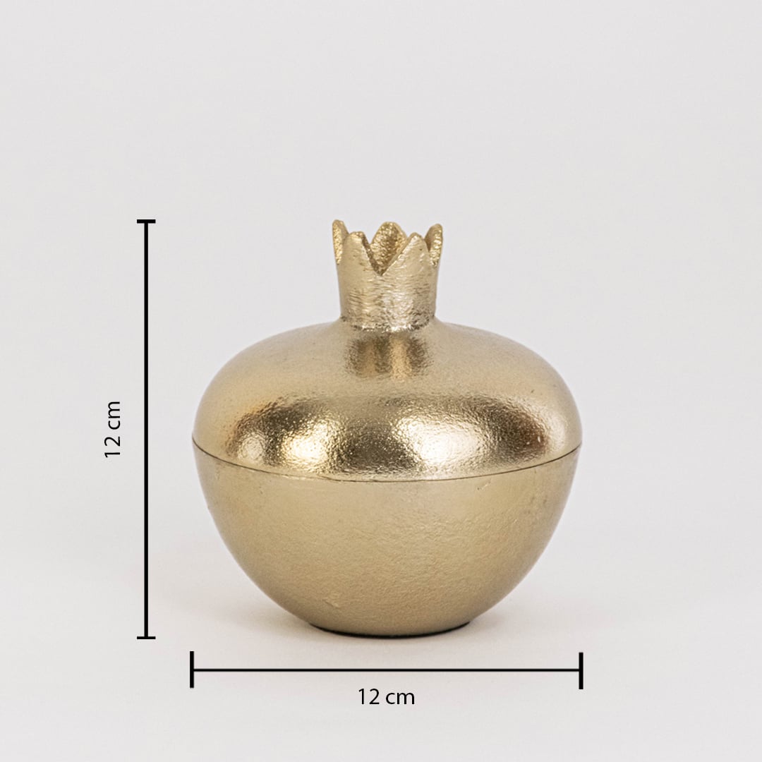 Gold metal pomegranate jar measuring 12 cm tall and 12 cm wide with crown lid and glossy finish shown on white wall