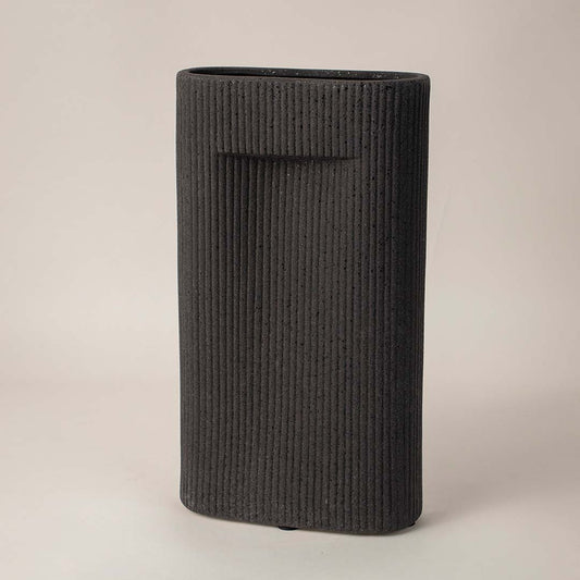 Side angle view of black rectangular ceramic vase with grooved texture perfect for living room or office interior styling.
