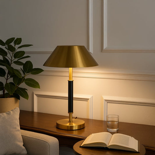 Gold metal table lamp with black stem and metallic shade for elegant modern lighting decor styling.