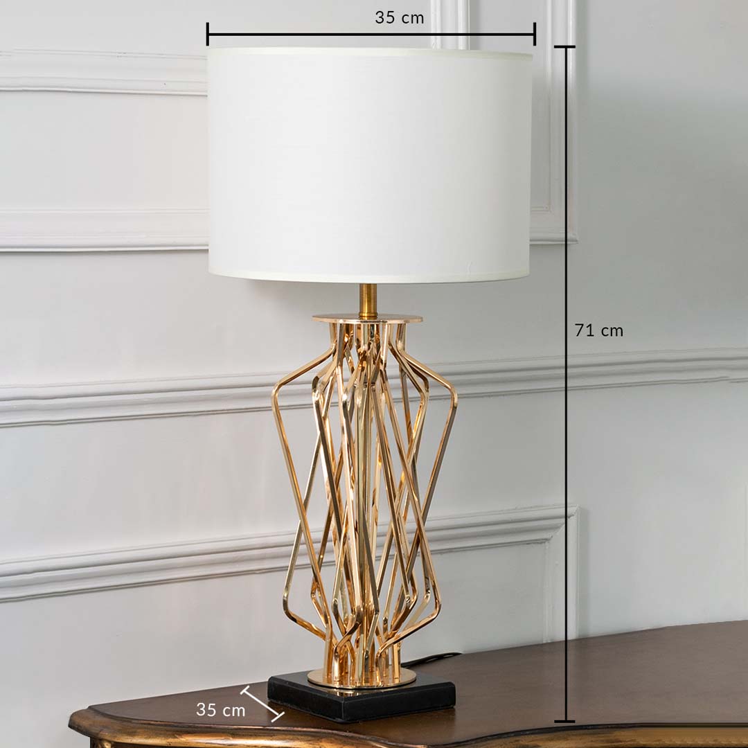 Gold twisted metal table lamp with white drum shade shown with clear dimensions of 35 cm width 71 cm height and 35 cm depth ideal for side tables or entryway consoles.