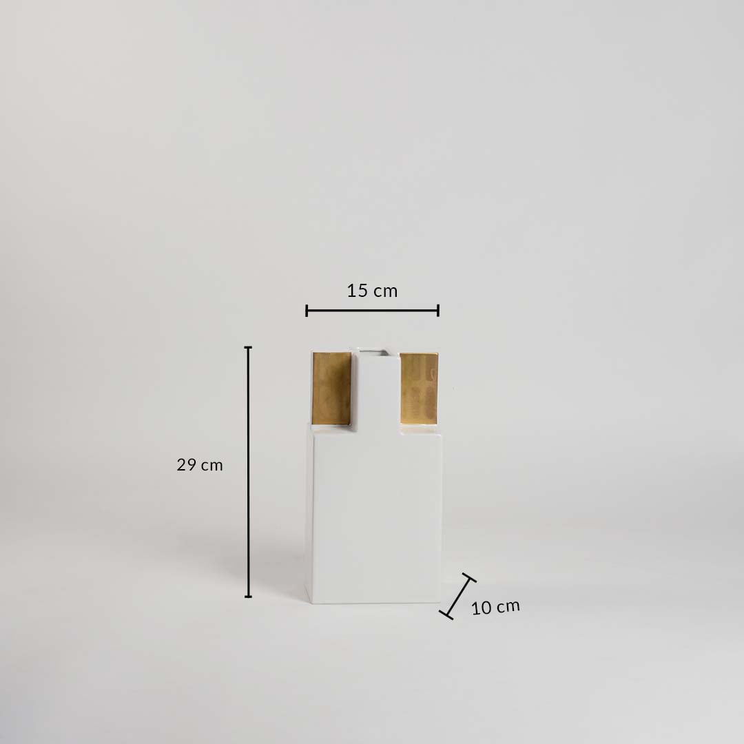 White ceramic vase with gold detailing shown with measurements 29 cm height 15 cm width and 10 cm depth on a clean white background.