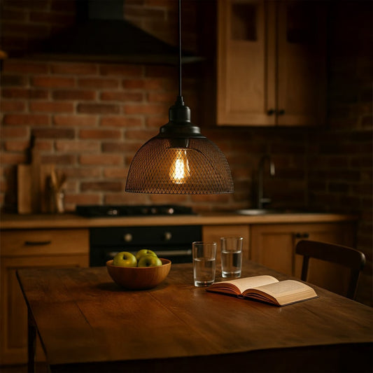 Amber glass pendant light above rustic wooden dining table creating warm ambient lighting in a modern kitchen setting.