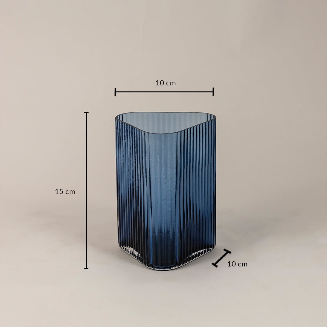 Ribbed blue glass vase with 15 cm height and 10 cm width shown on white background highlighting accurate product dimensions.