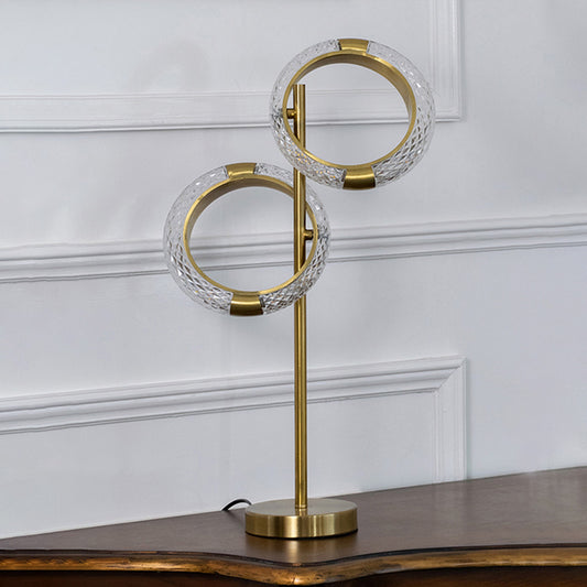 Gold metal ring table lamp with crystal accents designed for elegant modern decor and ambient table lighting indoors.