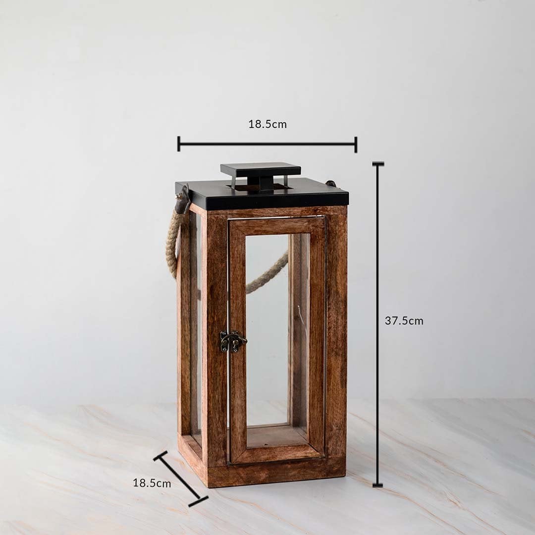 Tall wooden lantern dimensions 37.5cm height and 18.5cm width with rope handle and glass panels.