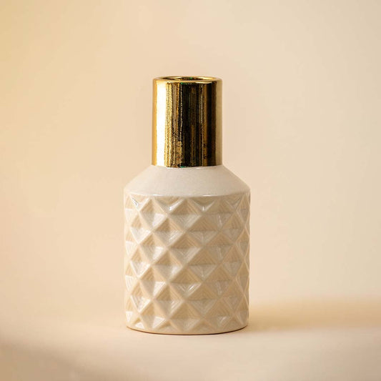 Textured white geometric vase with gold neck for modern luxury home decor and elegant shelf centerpiece style.