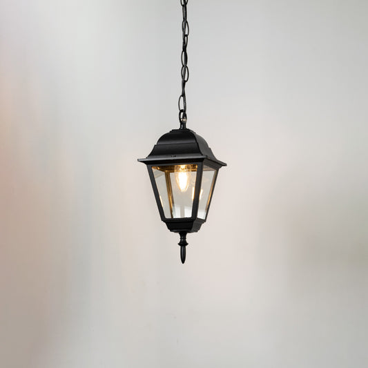 Contemporary black metal hanging lantern light with clear glass shade for balcony and patio lighting.
