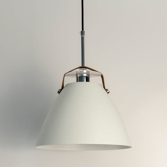 White pendant light off plain background featuring matte conical shade with metal rod and tan leather strap.