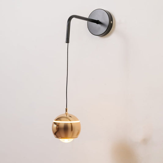 Spherical gold metal wall light turned on shown on white background for modern home and office decor.