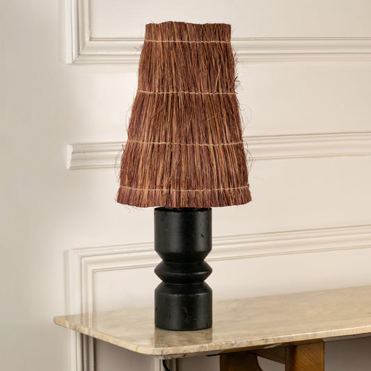 Table lamp with brown textured shade and black metal base perfect for bedroom or living room table decor on clean white background.