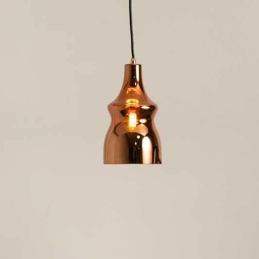 Copper metal pendant light glowing softly on a clean white background showcasing its modern reflective curved design.