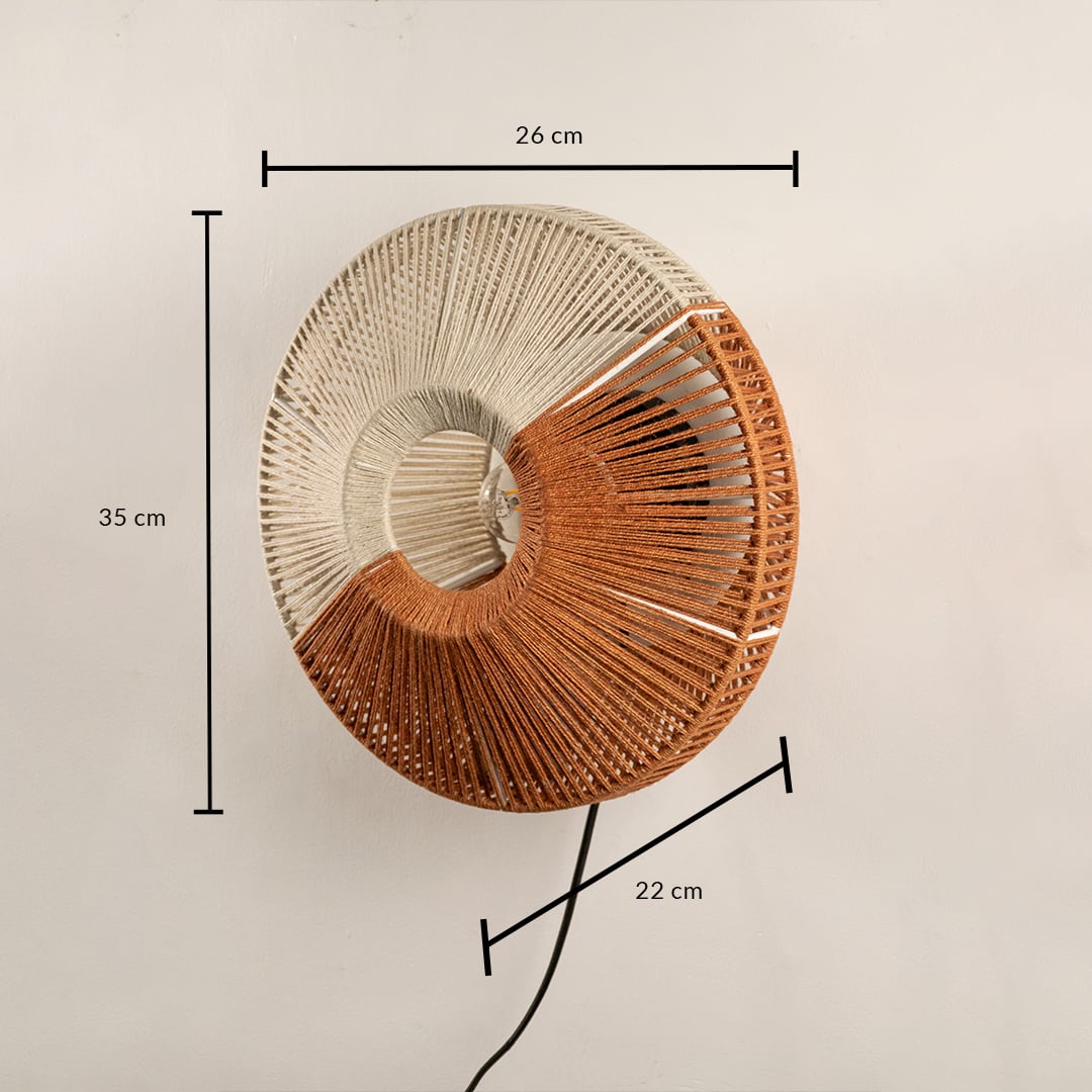 Round woven wall lamp in natural and warm tones shown with size of 60 cm width and 50 cm height adding a handcrafted textured accent to the interior.
