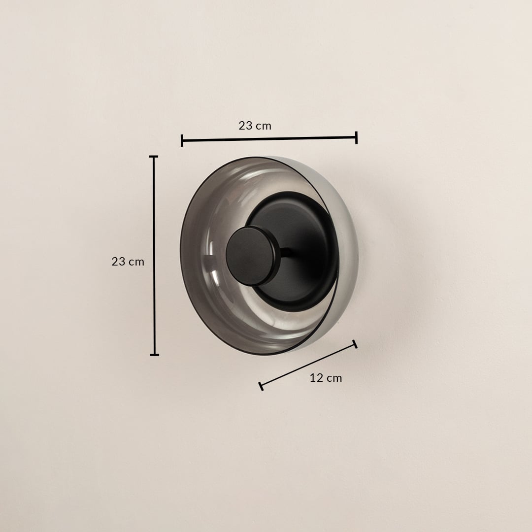 Round smoke glass wall light fixture showing a twenty-three centimeter height measurement mark on a plain background.