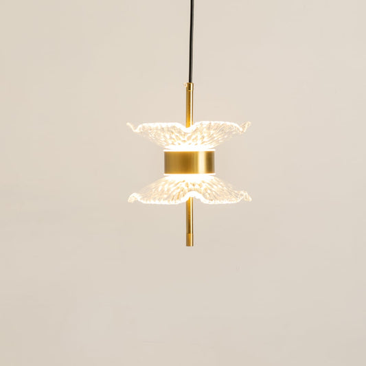 Gold pendant light with double textured glass shades glowing softly on a clean white background for modern home lighting decor.
