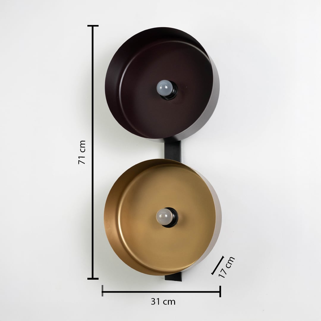 Wall light with bronze and gold bowls measuring 71 cm high and 31 cm wide mounted on vertical black frame.