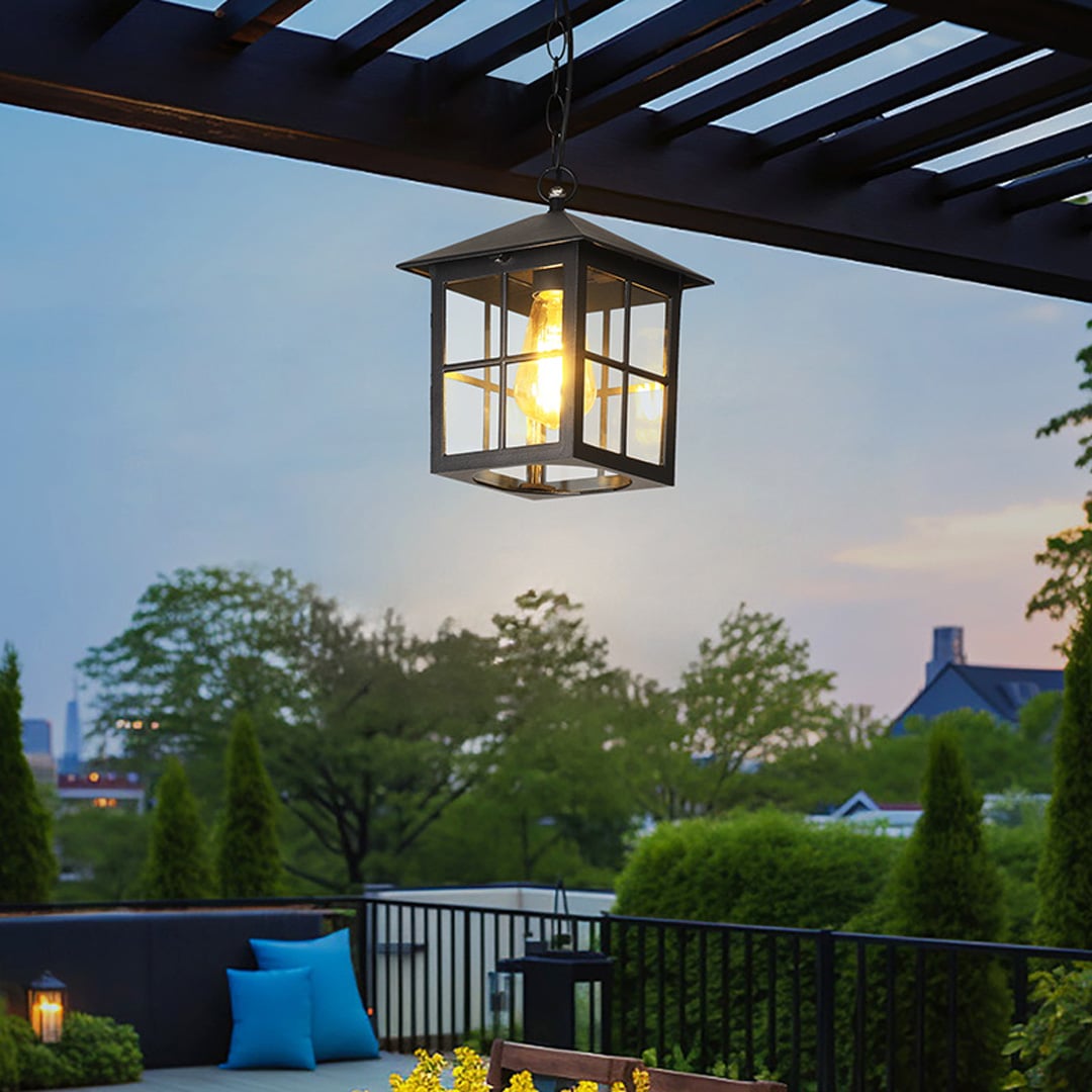 Contemporary black metal hanging lantern light enhancing modern balcony seating area with warm ambiance.