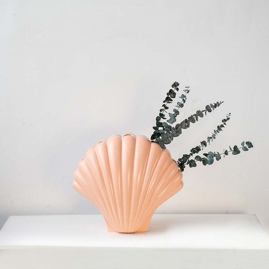 Peach shell decor with dried lavender styled on a shelf for coastal home decor and modern interior styling.