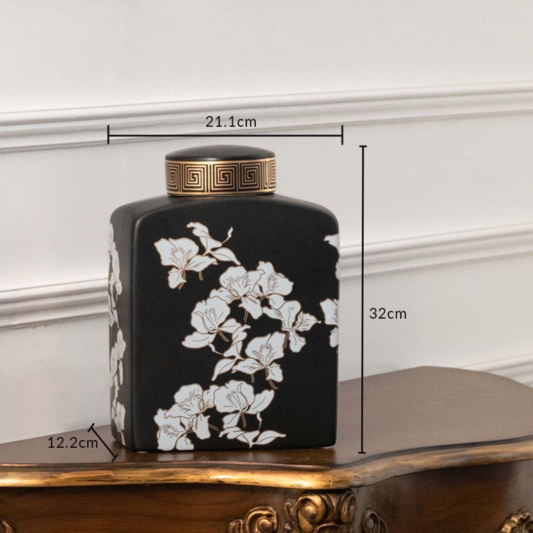 Black ceramic jar with white floral artwork measuring 16.5 cm width and 26 cm height ideal for elegant console décor and modern home styling.
