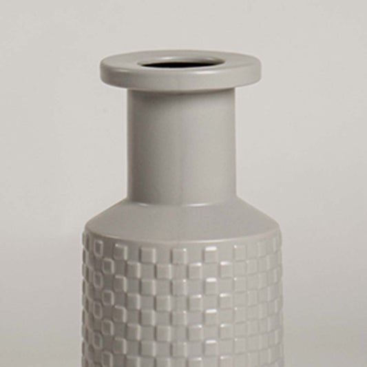 Closeup of light grey ceramic vase highlighting its embossed textured design and smooth finish ideal for stylish modern home decor.