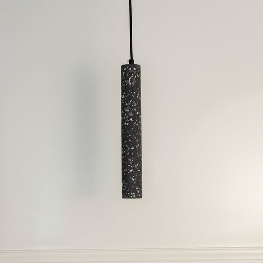 Amber glass pendant light turned off on white background displaying golden amber tint and smooth glass finish.