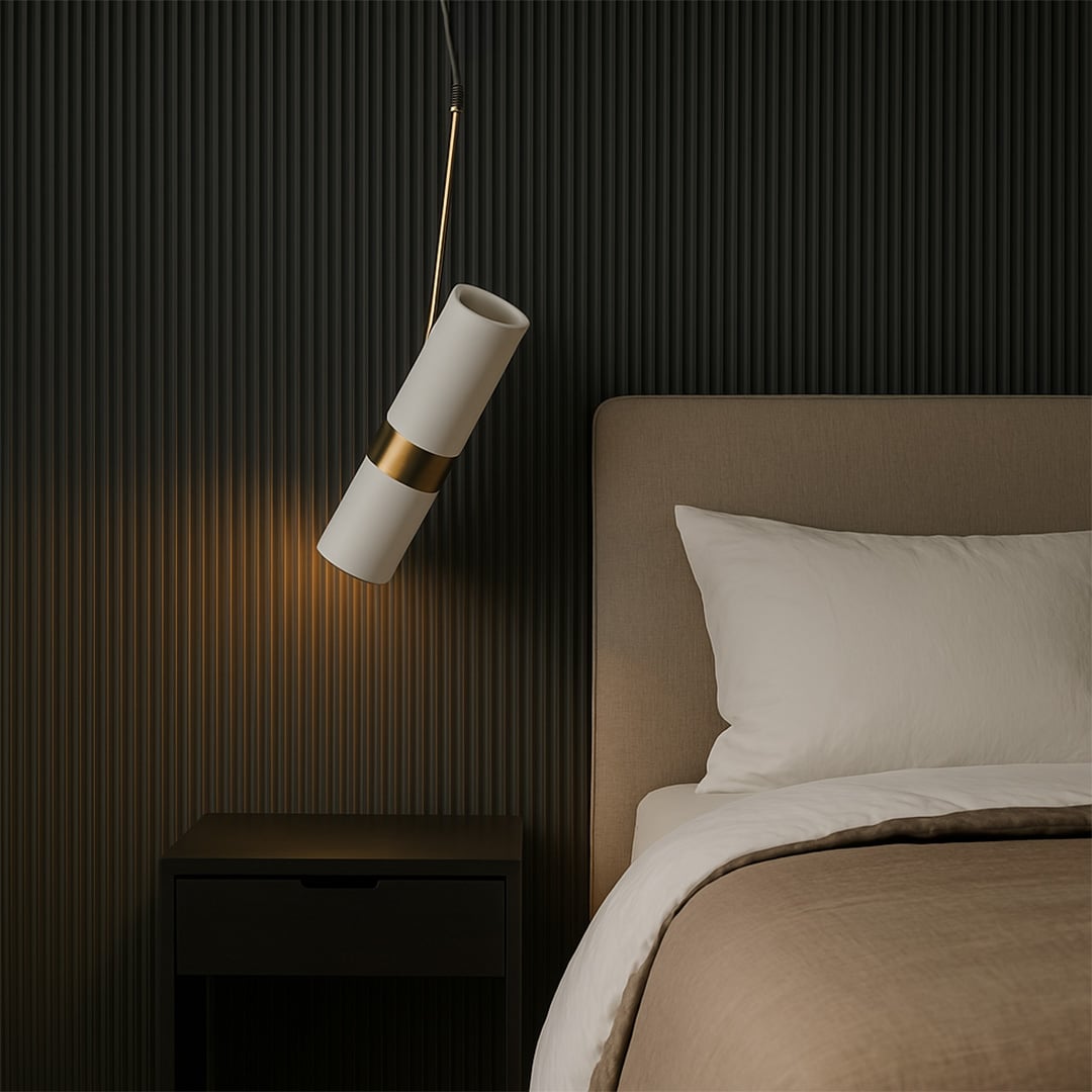 Stylish white and gold cylindrical pendant light glowing in luxury home setting modern ceiling lamp for dining and bedroom use.