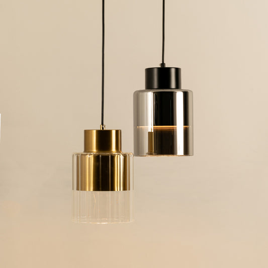 Elegant gold and silver pendant lights suspended for luxury modern interior and dining room decor styling.