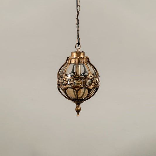 Unlit black metal globe hanging light fixture with decorative circular pattern cage isolated against a plain white background.