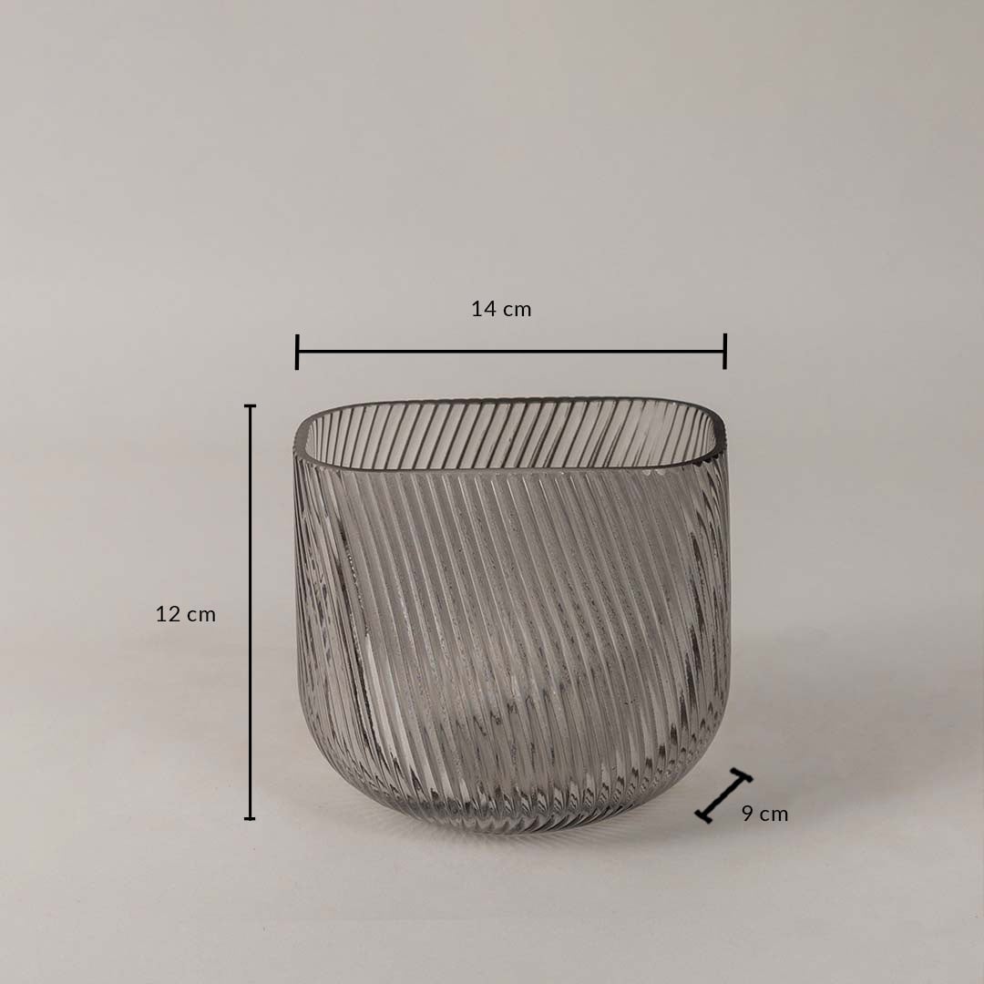 Smoky gray ribbed glass vase measuring 12 cm in height 14 cm in width and 9 cm in depth shown with dimensions.