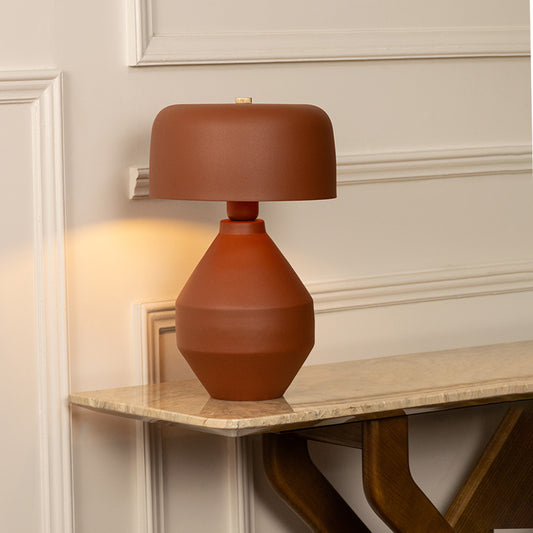 Elegant brown table lamp glowing warmly for cozy bedroom and modern living room decor styling.