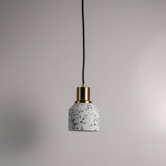 White terrazzo pendant light with black speckled finish and gold accents crafted for modern interiors.