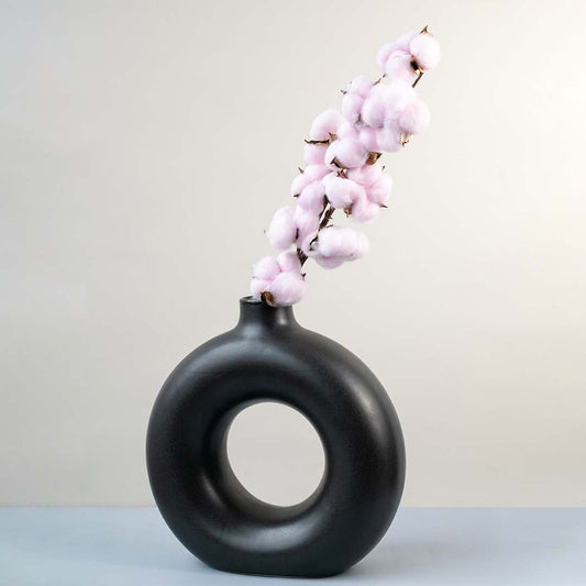 Pink cotton stem preserved artificial floral decor lifestyle display on white background for modern interiors.