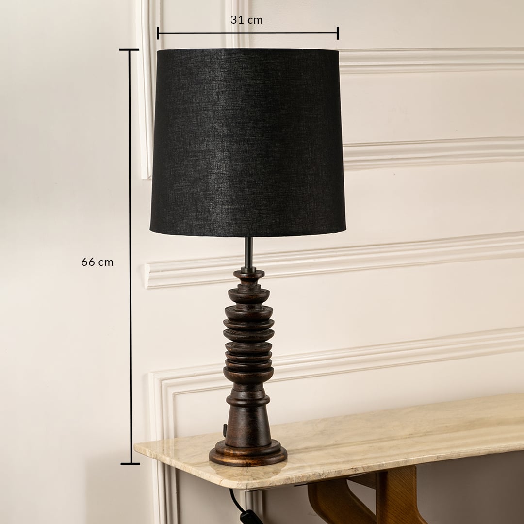 Dark wood table lamp with black fabric shade measuring 56 cm height and 24 cm width for elegant ambient lighting.