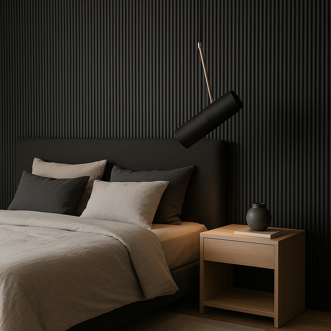 Modern black cylindrical pendant light with golden accent glowing above bed stylish ceiling lamp for luxury bedroom interiors