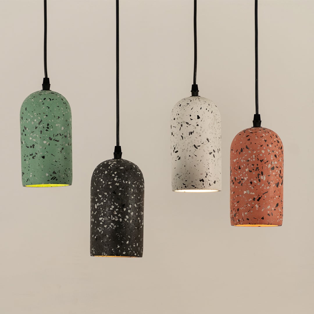 Multicolor terrazzo pendant lights with speckled finishes creating vibrant contemporary decor accents.