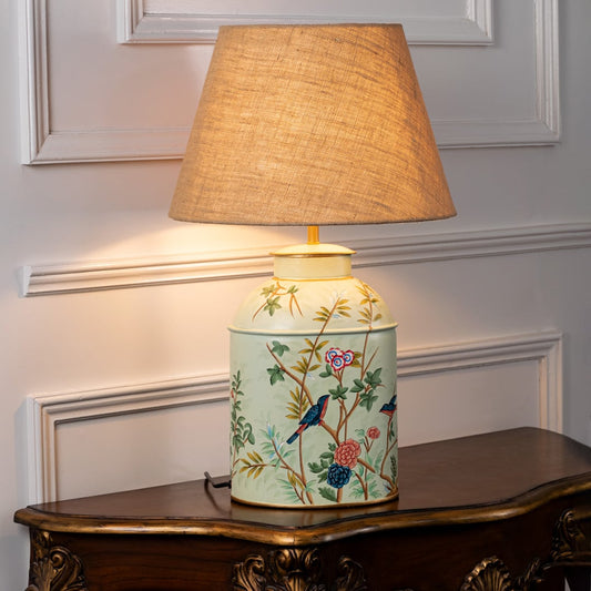 Tropical Garden green table lamp illuminated on white background showcasing leafy pattern vibrant glow and fresh interior decor mood.