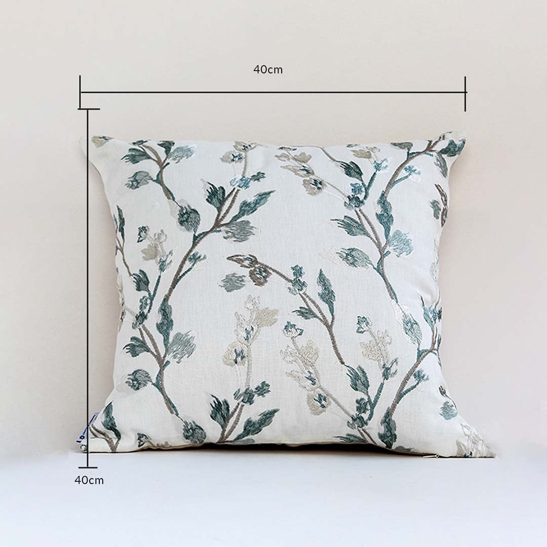 Botanical print cushion cover in teal shades presented with dimension markers confirming its 40 cm x 40 cm size helping users make correct home décor choices.
