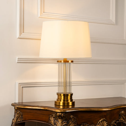 Gold lattice metal table lamp with fabric shade offering sophisticated decorative lighting for modern luxury interiors.
