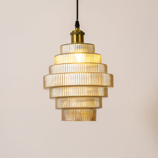 Decorative pendant light in gold metal finish with layered glass shade for kitchen or dining decor lighting white background.