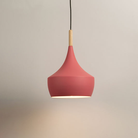 Pink pendant light with curved metal shade and wooden top on neutral background modern decorative lighting for bedroom and dining decor.