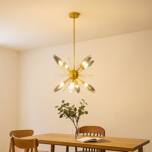 Modern gold chandelier with crystal glass rods styled in a luxurious living room adding elegance and ambient glow to interiors.