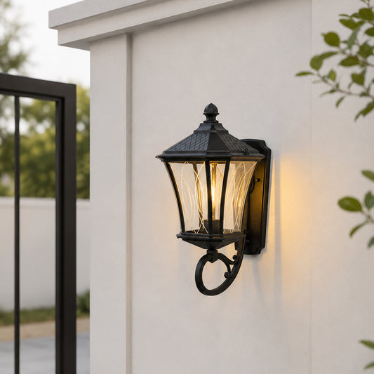 Vintage black metal and glass outdoor wall light for porch entrance balcony and exterior walls with warm ambient lighting.