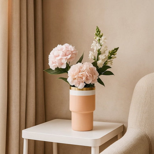 Peach ceramic vase with white band and gold rim styled in a modern interior perfect for shelves tables and elegant home decor accents.