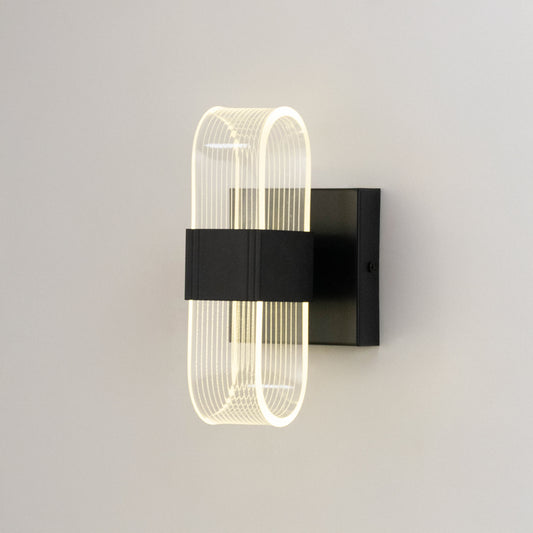 Minimal wall light in black metal finish with sculpted glass design for bedroom or living room decor lighting white background.