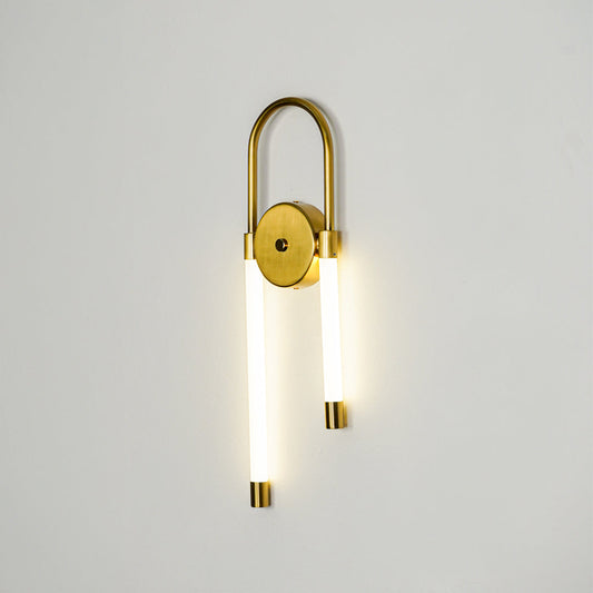Minimal gold wall sconce with cylindrical white glass shades on clean background perfect for modern interior accent lighting setup.
