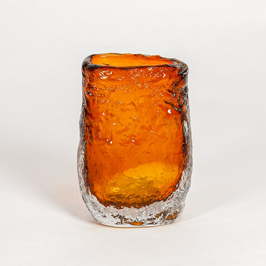 Amber decorative art glass vase on white background modern home decor accent piece for table shelf console styling interior.