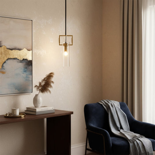 Elegant gold and glass pendant light hanging in a cozy living space with armchair decor soft curtains and warm ambient lighting.